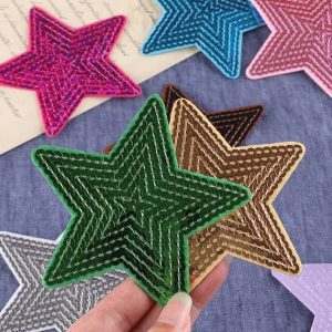 A person is holding Star Iron On Patches