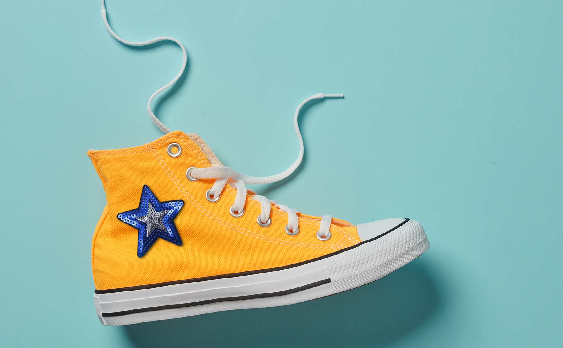 A pair of yellow shoes with sequin patches ,featuring iron-on patch ideas.
