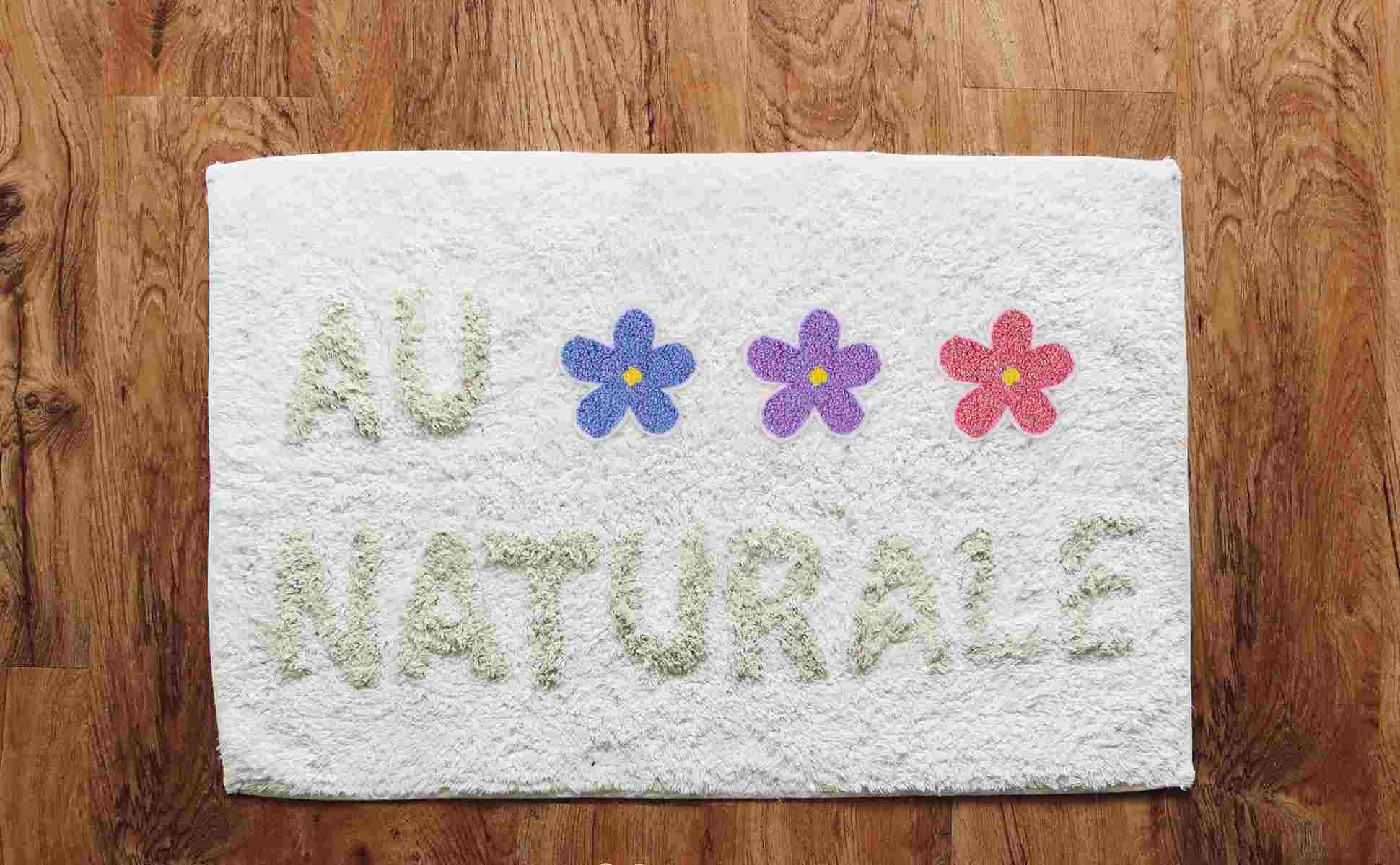 A white towel with the flower patches showcasing iron on patch ideas 